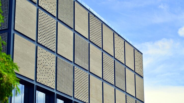 building-with-square-pattern-side-it_991208-27070