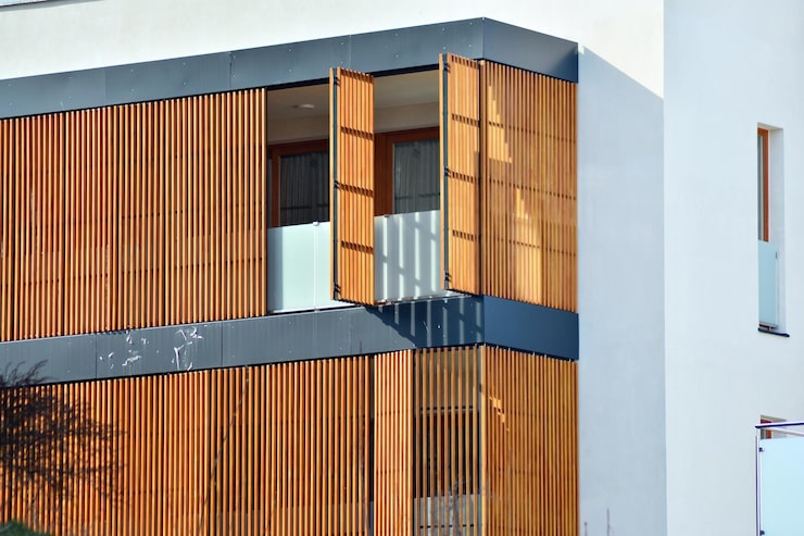 residential-building-sky-background-facade-modern-housing-construction-with-balconies_991208-13267